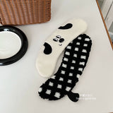 Black and white checkered toilet seat cushion