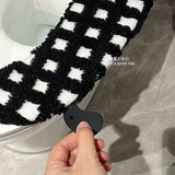 Black and white checkered toilet seat cushion