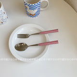 Red and white checkered tableware set